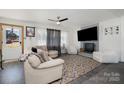 Living room featuring a fireplace, comfy seating, and large TV at 1241 Red River Rd, Rock Hill, SC 29730