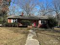 Brick ranch house with red door and walkway at 147 W Mcneely Ave, Mooresville, NC 28115