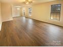 Spacious living room with hardwood floors and lots of natural light at 310 Ann Baker Ct, Charlotte, NC 28217