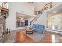 Cozy living room with staircase and view into kitchen at 346 Almora Loop, Mooresville, NC 28115