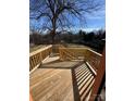 An empty wooden deck with a view of the yard, surrounded by a wooden safety rail at 523 W Front St, Statesville, NC 28677