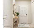 Bright entryway with a console table, lamp, mirror, and rug at 5901 Oak Branch Cir, Maiden, NC 28650