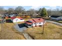 Expansive aerial view showcasing the house, detached garage and surrounding property at 601 N 12Th St, Bessemer City, NC 28016