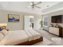 Virtually staged main bedroom with a TV and access to a sunroom at 8200 Suttonview Dr, Charlotte, NC 28269