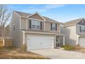 Two-story house with neutral siding, white garage door, and landscaping at 9025 Creedmore Hills Dr, Charlotte, NC 28214