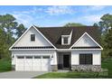 Beautiful two-story home with white siding, black accents, and a two-car garage at Lot 109 Mayes Meadow Dr # Woodford, Cornelius, NC 28078