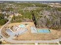 Community amenities include a swimming pool, tennis court, and playground nestled amidst lush landscaping and natural beauty at 1135 Rudder Cir, Salisbury, NC 28146
