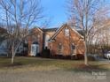 Two-story brick home with a large front yard at 130 Swift Creek Ln, Mooresville, NC 28115