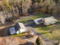 Aerial view of house and detached garage on large lot at 1360 Hopewell Church Rd, Catawba, NC 28609