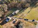 Aerial view showing home, detached garage, and spacious grounds at 1360 Hopewell Church Rd, Catawba, NC 28609