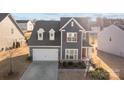 Well-manicured front yard leads to a lovely two-story home, complete with an attached garage and a cozy entrance at 2025 Killian Creek Dr, Denver, NC 28037