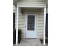 Front entrance with white door and storm door, featuring a covered porch at 217 22Nd Sw St # H, Hickory, NC 28602