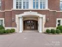 Elegant building entrance with columns and double doors at 2223 Croydon Rd # 103, Charlotte, NC 28207