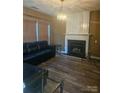 Living room features a fireplace and hardwood floors at 2409 Deberry Ct, Charlotte, NC 28213