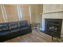 Living room features a fireplace and hardwood floors at 2409 Deberry Ct, Charlotte, NC 28213