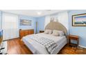 Bright bedroom with hardwood floors and a comfortable bed at 2431 17Th Ne St # 9-13, Hickory, NC 28601