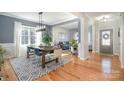 Open dining room with hardwood floors and a farmhouse table at 245 Sweet Briar Dr, Fort Mill, SC 29707