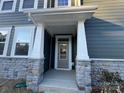 Front entrance with stone accents and a covered porch at 284 Laura Elizabeth Ln, Clover, SC 29710