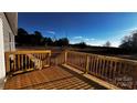 Outdoor deck featuring wooden railings and wood floor with sunny skies in the background at 507 E Lackey Farm Rd, Stony Point, NC 28678