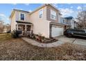 Two-story house with attached garage and landscaping at 5124 Stone Park Dr, Charlotte, NC 28269