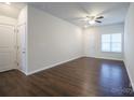 Bright living room featuring hardwood floors and neutral walls at 6340 Revolutionary Trl, Charlotte, NC 28217