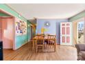 Bright living room featuring hardwood floors and a dining area at 6534 Monteith Dr, Charlotte, NC 28213