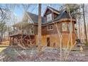 Log home showcasing a side view with deck and landscaping at 7404 Mockingbird Ln # 73, Waxhaw, NC 28173