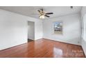 Bright bedroom with hardwood floors and ceiling fan at 809 Hasty Rd, Marshville, NC 28103