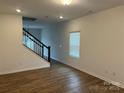 Bright living room featuring hardwood floors and a staircase at 813 Gondola Ct # 107, Salisbury, NC 28144