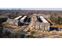 Townhome community offering various views and a city skyline in the background at 824 Broad River Ln, Charlotte, NC 28211