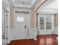 Bright entryway with hardwood floors, decorative glass, and wainscoting at 1010 Craven St, Indian Trail, NC 28079