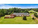 Aerial view of a large brick building on a plot of land at 1318 Ostwalt Amity Rd, Cleveland, NC 27013