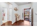 Inviting foyer with hardwood floors, decorative accents, and a stylish front door at 16812 Lookout Landing Ln, Charlotte, NC 28278
