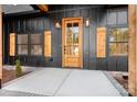 A beautiful wood door with sidelights and stone accents at 2403 Lee Lawing Rd, Lincolnton, NC 28092