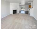 Spacious living area with a fireplace and access to backyard at 3217 Ian Patrick Ave, Kannapolis, NC 28083