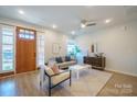 Bright living room featuring a comfy sofa and wooden coffee table at 339 East Blvd, Charlotte, NC 28203