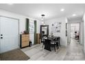 Bright dining area featuring modern lighting, stylish decor, and an open layout perfect for entertaining at 3411 Rogers St, Charlotte, NC 28208