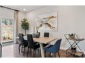 Bright dining area with hardwood floors and sliding glass doors to a patio at 3510 Backwater St, Concord, NC 28027