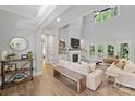 Open living room with hardwood floors, a fireplace, and ample natural light at 4311 Craig Ave, Charlotte, NC 28211