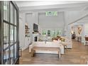 Spacious living room with high ceilings, fireplace, and access to backyard at 4311 Craig Ave, Charlotte, NC 28211