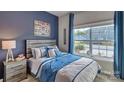 Bright bedroom with a full bed, NFL themed decor and large window at 4606 Harris Elliot Rd, Lincolnton, NC 28092