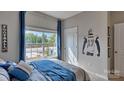 Bedroom with full bed, large window, and a football player wall decal at 4606 Harris Elliot Rd, Lincolnton, NC 28092