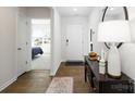 Bright entryway with hardwood floors, console table, and views into adjacent rooms at 4614 Harris Elliot Rd, Lincolnton, NC 28092