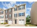 Beautiful townhouse with tan siding, black shutters and single car garage at 828 Renee Ave, Fort Mill, SC 29715