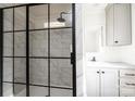 Modern bathroom with a frameless glass shower and marble-look tile at 118 River Ridge Ln, Hickory, NC 28601