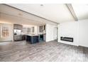 Open concept kitchen with island, stainless steel appliances, and gray cabinets at 118 River Ridge Ln, Hickory, NC 28601