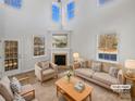 Virtually staged living room with fireplace and high ceilings at 14602 Lions Paw St, Charlotte, NC 28273