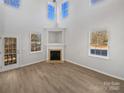 Bright living room featuring a fireplace and hardwood floors at 14602 Lions Paw St, Charlotte, NC 28273