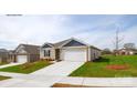 Beautiful single story home featuring a two-car garage, manicured lawn, and inviting curb appeal at 1766 Falls Cove Rd, Newton, NC 28658
