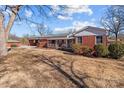 Brick ranch house with a carport at 200 11Th St, Spencer, NC 28159